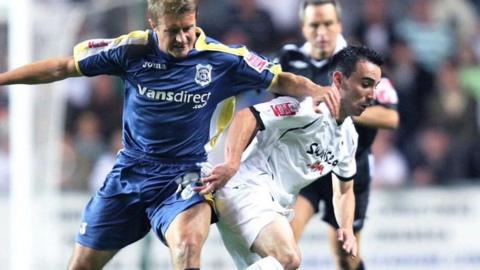 Leon Britton in action against Stephen McPhail in a Cardiff v Swansea game