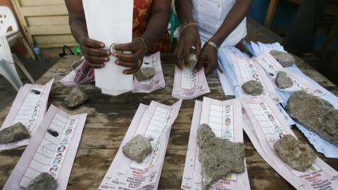 Scrutineers organise ballots papers on election day, 21 April 2007, in Lagos, Nigeria