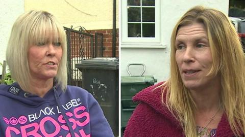 Two women talking about bins in Conwy