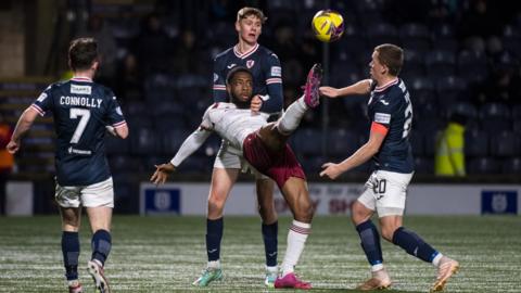 Arbroath's Daniel Fosu is watched closely by three Raith players