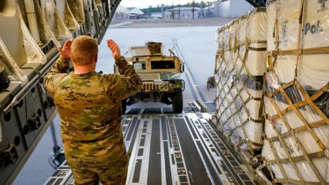 Military personnel with the 82nd Airborne Division load a HMMWV aboard a C-17 transport plane for deployment to Eastern Europe amid escalating tensions between Ukraine and Russia, at Fort Bragg, North Carolina, U.S., February 6, 2022