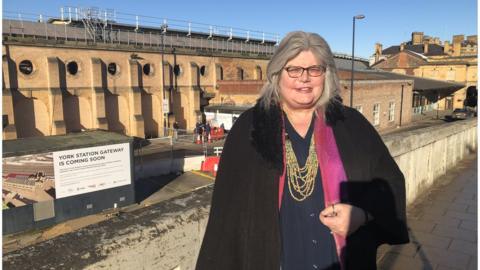 Sue Pasco in front of York train station