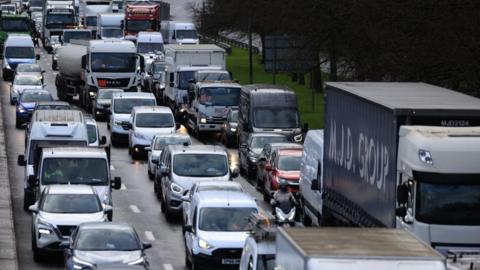 Traffic builds up on the north circular road in London on 28 March 2024