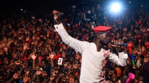 Bobi Wine appears on stage on the outskirts of Kampala