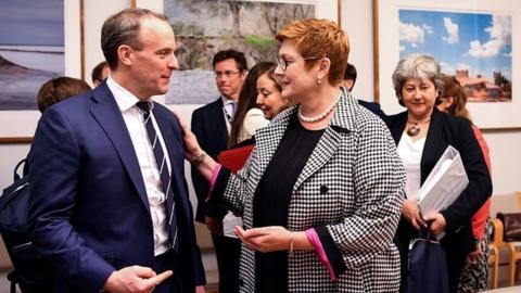 Australia's Foreign Minister Marise Payne talks to Britain's Foreign Secretary Dominic Raab