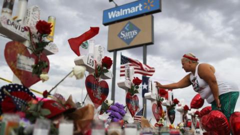 People pay their respects at Walmart, El Paso