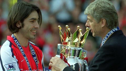 Robert Pires and Arsene Wenger in 2002 after Arsenal are crowned Premier League champions
