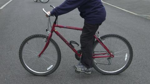 Boy on bicycle