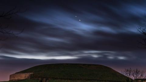 Jupiter and Saturn pictured over Newgrange in County Meath