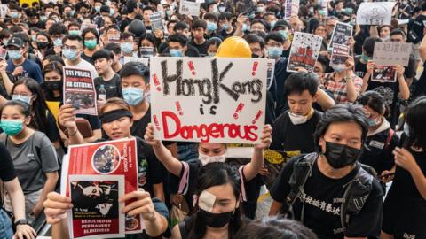 Protesters occupy the arrival hall of the Hong Kong International Airport during a demonstration on 12 August