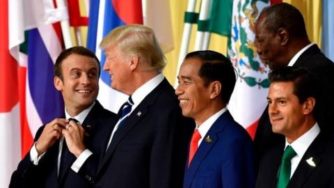 Emmanuel Macron, Donald Trump, Joko Widodo, Enrique Pena Nieto and other G20 leaders stand for a family photo in Hamburg, 7 July