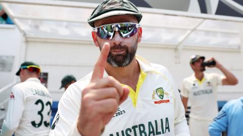 Australia bowler Nathan Lyon holds up his index finger after Australia win the World Test Championship