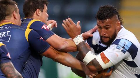 Bristol forward Nathan Hughes is tackled by the Worcester defence