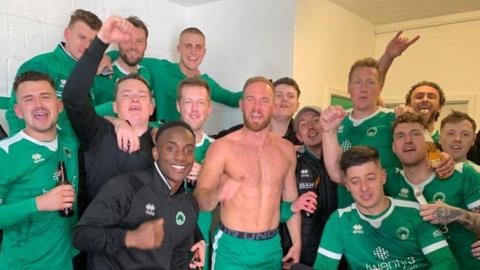 Newport Pagnell FC celebrate their victory in the FA Vase semi-final.