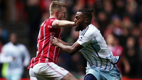 Bristol City's Ross McCrorie is challenged by is challenged by Nuno Tavares of Nottingham Forest