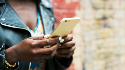 woman holding phone