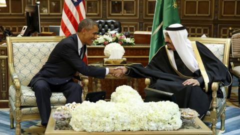 President Obama and King Salman shaking hands and smiling