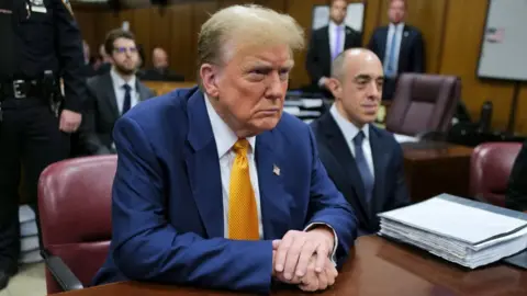 Former US President Donald Trump attends his trial for allegedly covering up hush money payments linked to extramarital affairs, at Manhattan Criminal Court in New York City, on May 2, 2024.