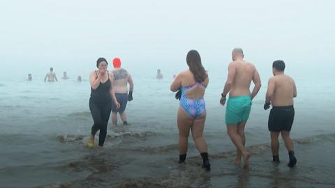 Swimmers getting into the sea