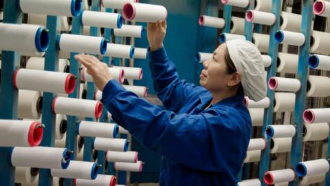 This photo taken on February 22, 2018 shows a woman working at a textile factory in Haian in China's eastern Jiangsu province