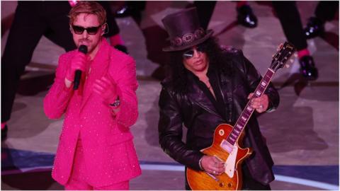 Ryan Gosling and Slash perform on stage at the Oscars