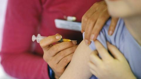 A child receives the measles vaccine