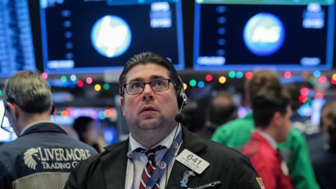 Traders work on the floor of the New York Stock Exchange (NYSE) in New York, U.S., December 7, 2018.