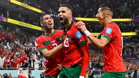 Morocco players celebrate their winner against Portugal