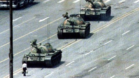 Tank man, an unknown person famously pictured standing before tanks in Tiananmen Square in 1989