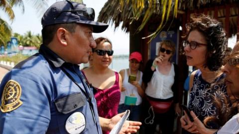 A guard faces members of Women on Waves, 24 Feb 2017, Guatemala