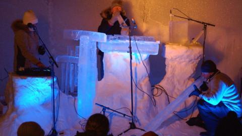 Musicians playing ice instruments