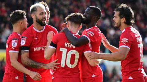 Swindon celebrate Dan Kemp's goal