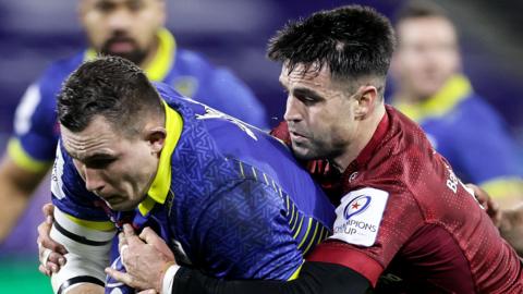 Paul Jedrasiak is tackled by Conor Murray