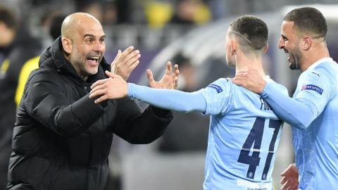 Pep Guardiola and Phil Foden