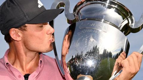 Ludwig Aberg kisses the European Masters trophy after his win on Sunday at Crans-sur-Sierre