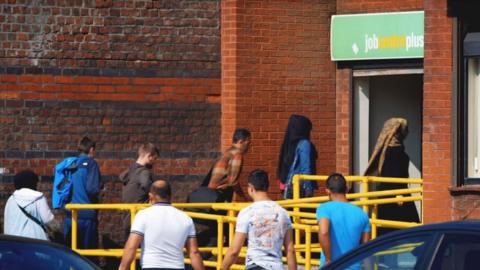 People queue at job centre