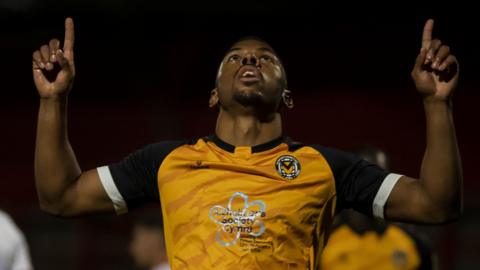 Tristan Abrahams celebrates after scoring from the spot