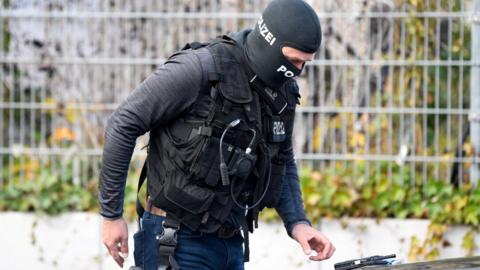 A police officer works at the scene of a threat situation at a school in the Blankenese district