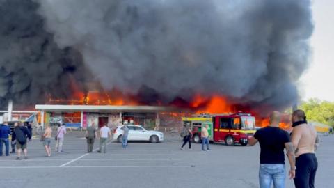 Flames engulfing the mall in Kremenchuk