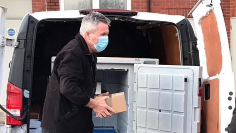 The vaccine being carried ion a carboard box