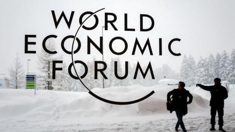 A security guard show the way outside the congress centre ahead of the World Economic Forum (WEF) 2018 meeting in Davos