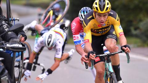 Julian Alaphilippe(back left) crashes behind Wout van Aert and Mathieu van der Poel