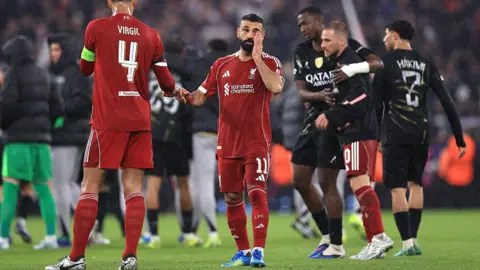 Liverpool bus arrives amid red flare smoke