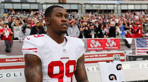 The San Francisco 49ers' Aldon Smith sits on the sidelines
