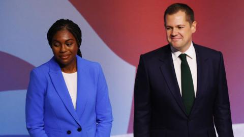 Kemi Badenoch and Robert Jenrick on stage at the Conservative party conference in Birmingham