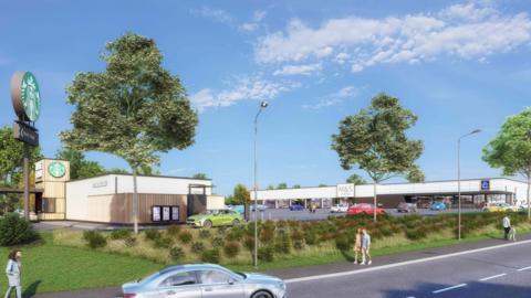 A computer generated image of the proposed retail development in Silksworth set to house an M&S Foodhall, Aldi supermarket and Starbucks drive-thru. The M&S and Aldi unit is a one-storey building with white cladding and a car park in front of it. At the opposite end of the car park from the shops is a small single-storey building with wood cladding housing a Starbucks drive-thru.