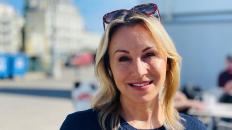 A Brighton mother on the city's seafront