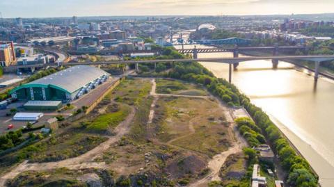 An aerial view of the River Tyne showing an old brownfield site.