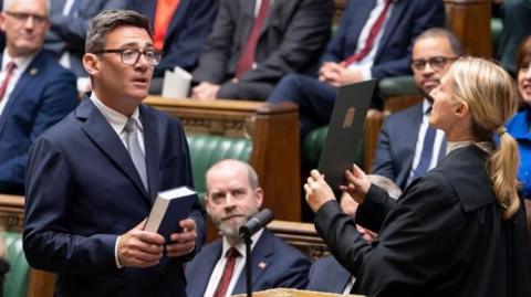 Andy Burnham being sworn in as an MP at Parliament