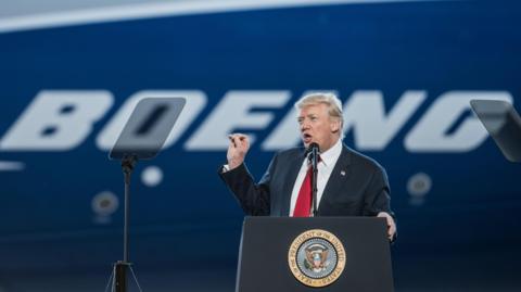 US President Donald Trump addresses a crowd at the debut event for the Boeing Dreamliner 787-10 on February 17, 2017.